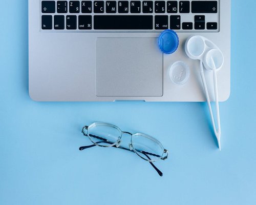 professional sitting with correct posture at a clean workspace with laptop